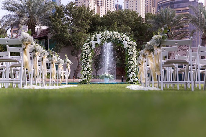 Nigerian destination wedding Dubai flower arch