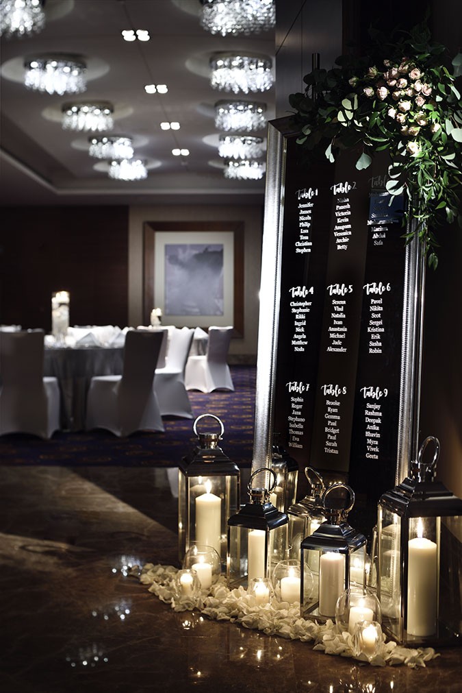remarkable wedding planners dubai - mirrored table plan ballroom entrance