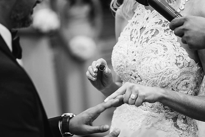 Bride and Groom exchanging rings. 