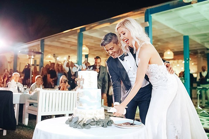 Bride and Groom cutting cake. 