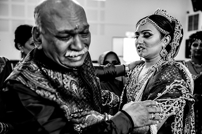 Indian bride and father dancing at wedding