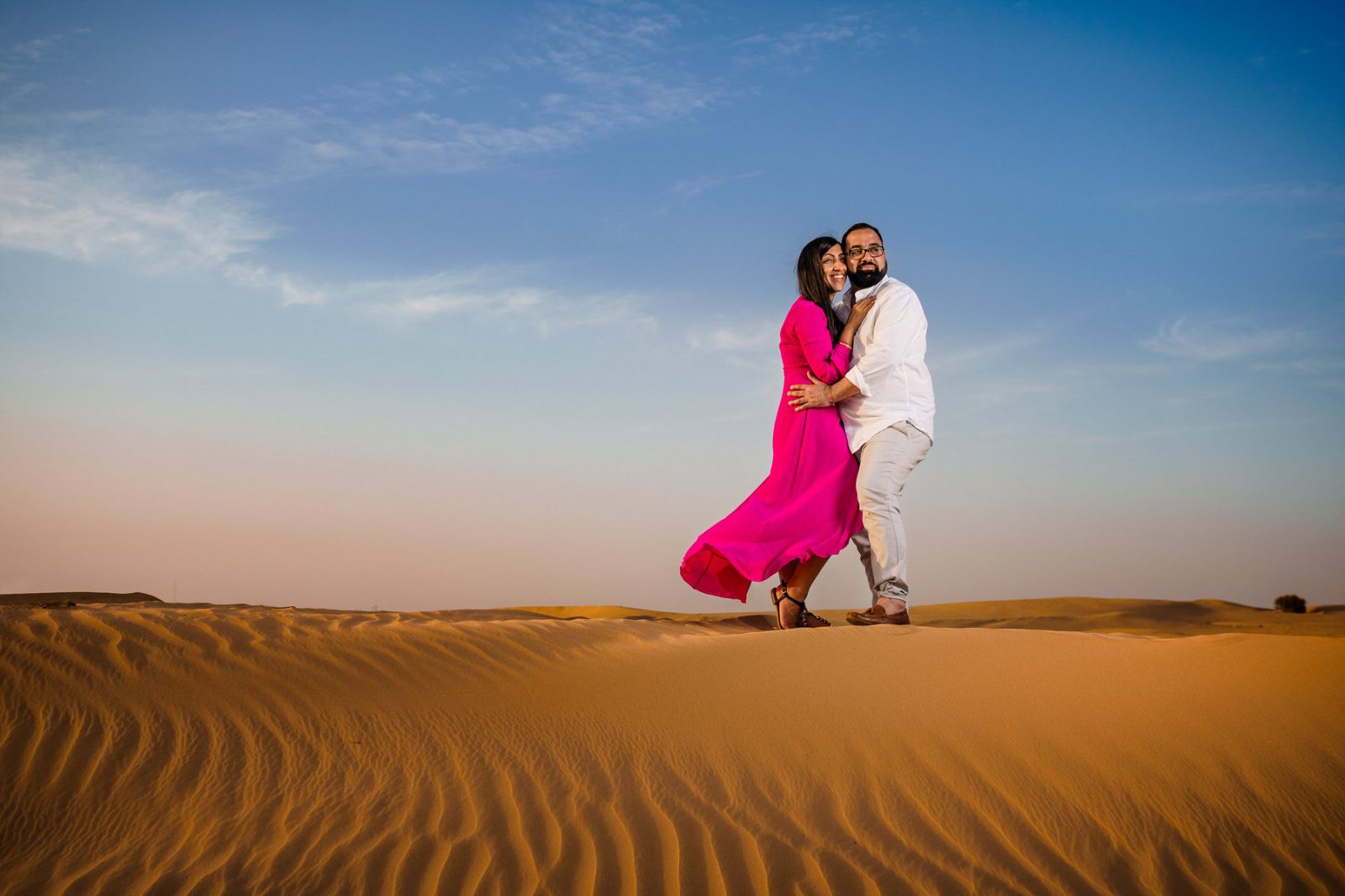 Couple posing in the Dubai desert