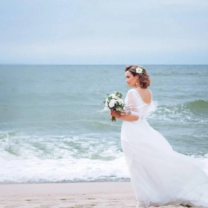 A bride at the beach at the Intercontinental RAK Mina Al Arab