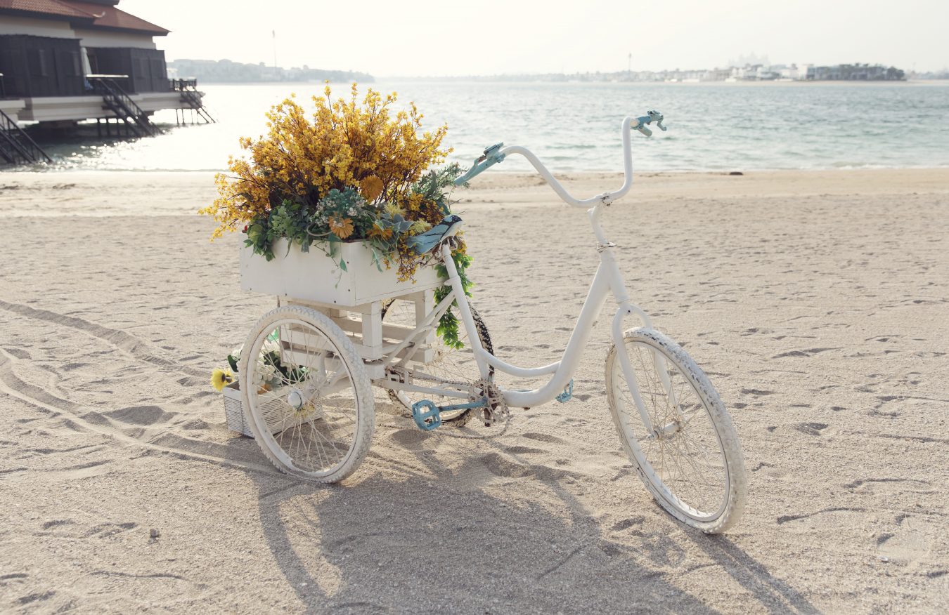 A white bicycle at the beach