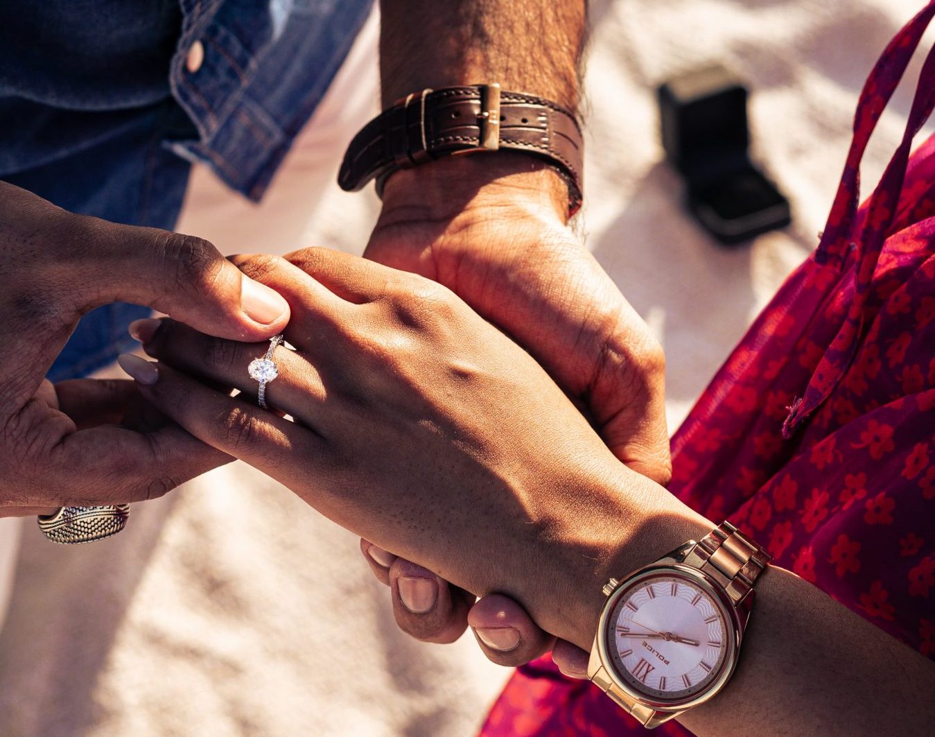 A couple with an engagement ring