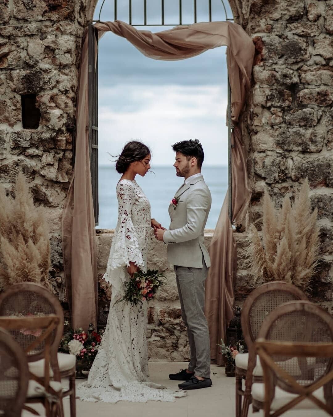 A wedding couple in a rustic venue