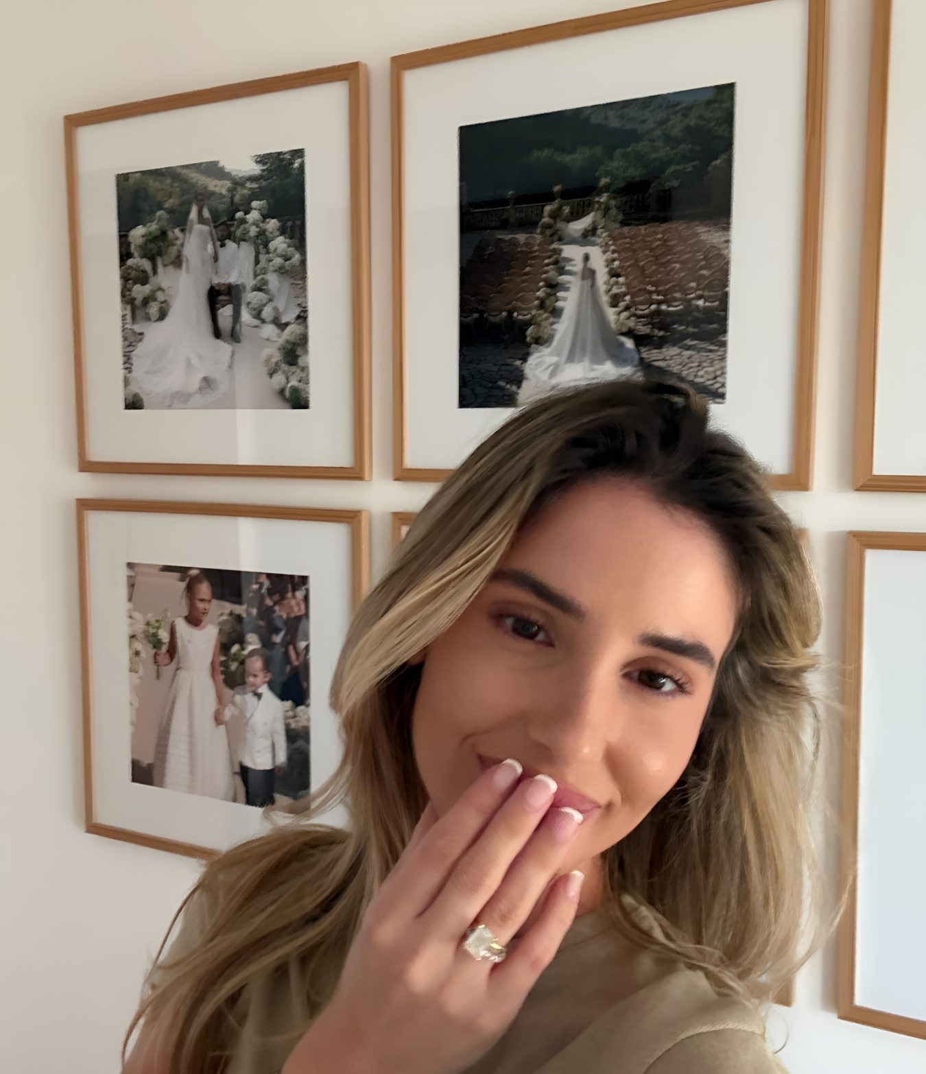 A happy bride with her wedding pictures from Wall Street Dubai